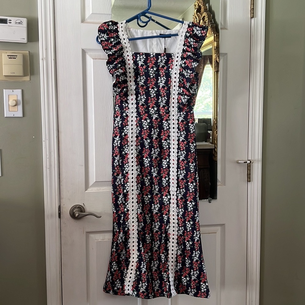 Vintage style, dark blue with white and dark orange flowers pattern with leaves